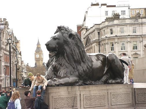 Trafalgar Square lion with Big Ben Tower in distance