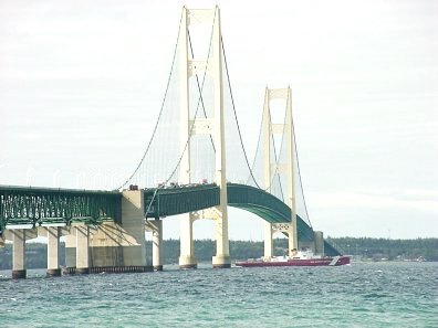 USCG cutter Mackinaw passing under the Macinac Bridge