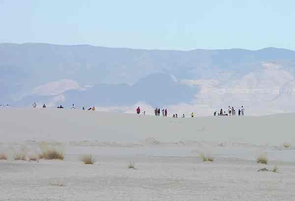 Sledding on the dunes at White Sands National Monument