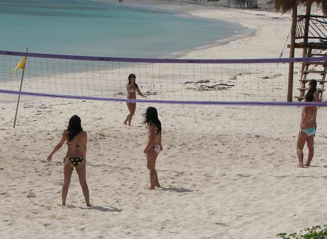 beautiful girls playing vollyball on the beach at Cozumel