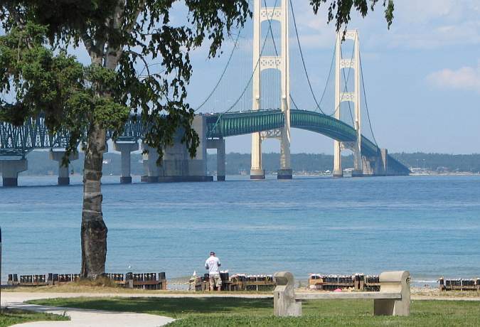 setting up fireworks display next to the Mackinac bridge