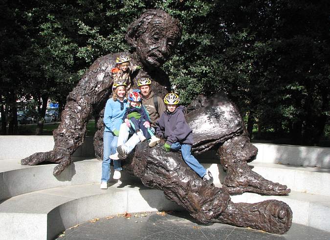 Family posing on the Einstein Memorial in Washington DC.