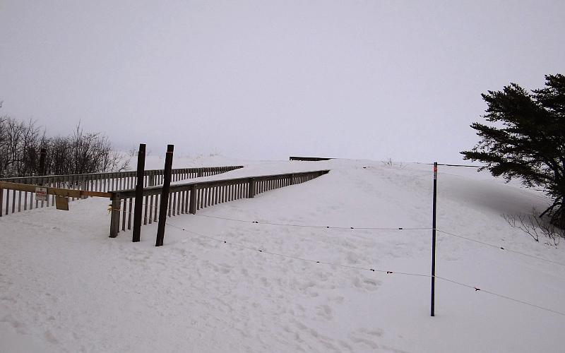 Snow and ice covered walkway to the Lake Superior shore