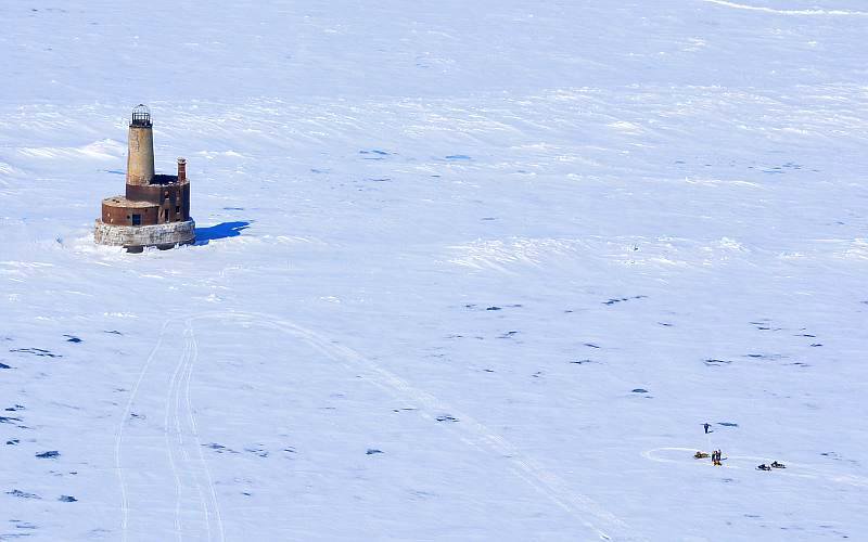 snowmobiles visit Waugoshance Lighthouse