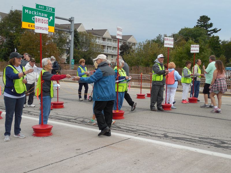 Giving out Mackinac Bridge walk certificate