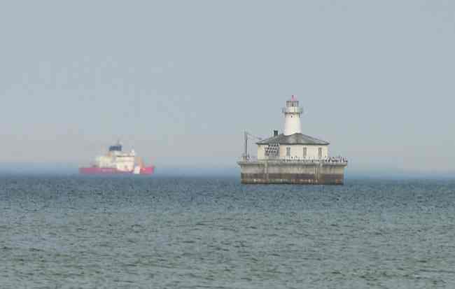 Coast Guard Cutter Mackinac and Fourteen Foot Shoal Lighthouse