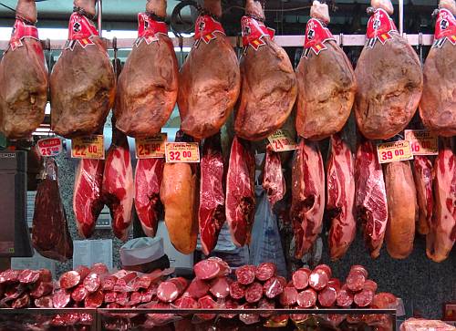hams hanging in the Museo del Jamn in Madrid, Spain