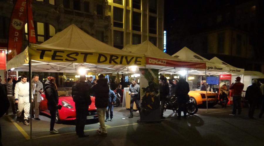 Ducati motorcycles and Ferrari vehicles on display