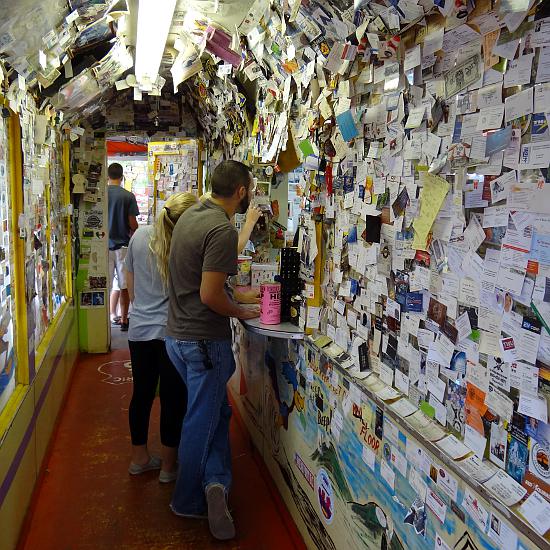 Delgadillo's Snow Cap Drive-In buisness card lined hallway