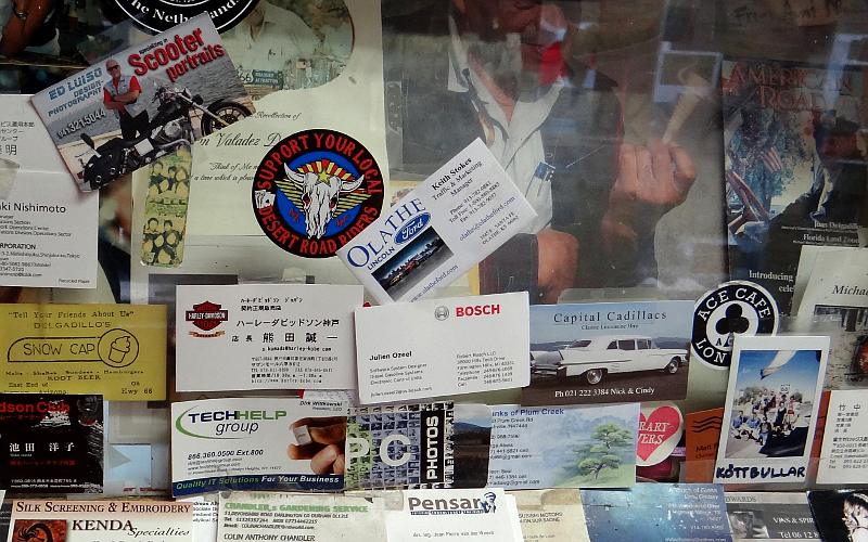 Olathe Ford business card on the wall at Delgadillo's Snow Cap Drive-In.